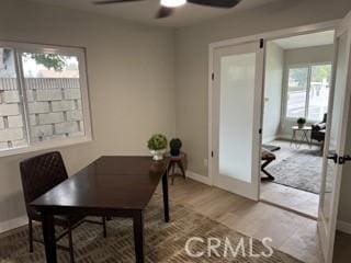 office featuring ceiling fan, french doors, wood finished floors, and baseboards