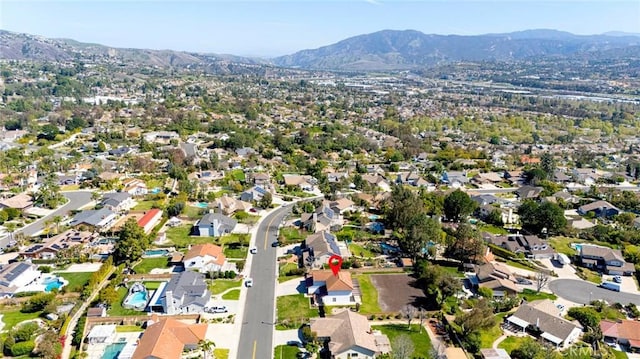 drone / aerial view with a residential view and a mountain view