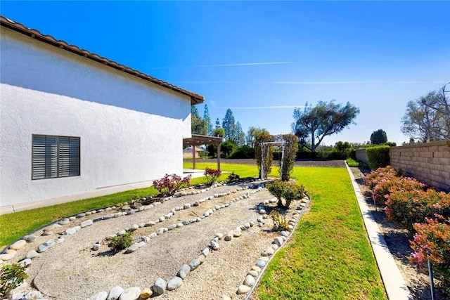 view of yard with fence