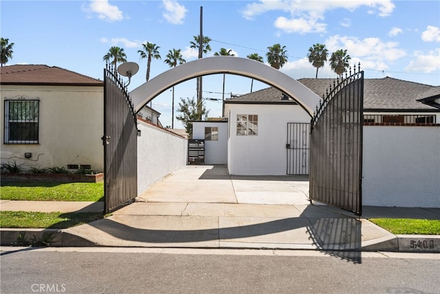 view of gate featuring fence