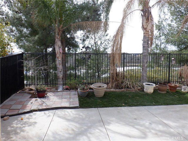 view of yard featuring a patio area and fence