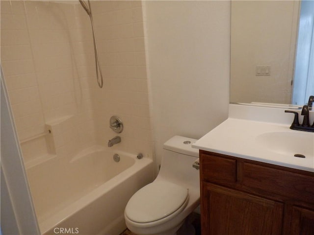 bathroom featuring toilet, bathtub / shower combination, and vanity