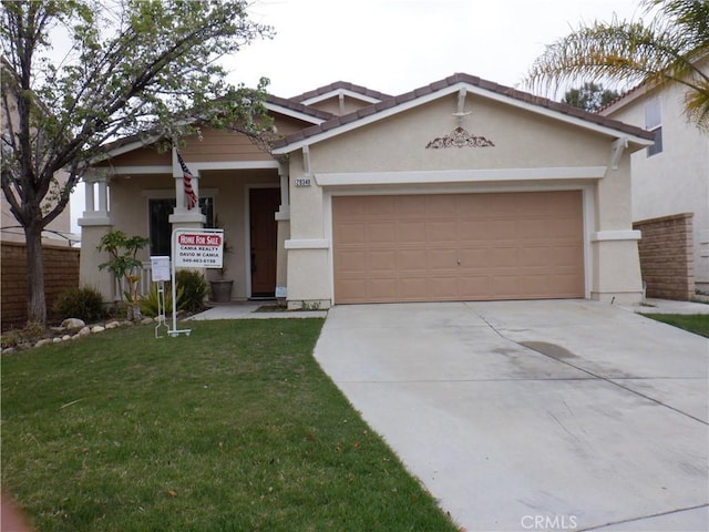 view of front of home with driveway, stucco siding, and an attached garage