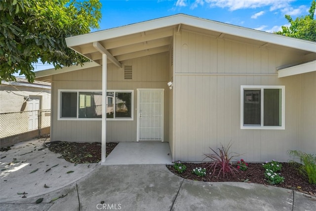 doorway to property with fence