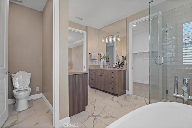 bathroom with marble finish floor, visible vents, a stall shower, vanity, and baseboards