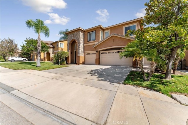 view of front of home featuring an attached garage, concrete driveway, stone siding, stucco siding, and a front lawn