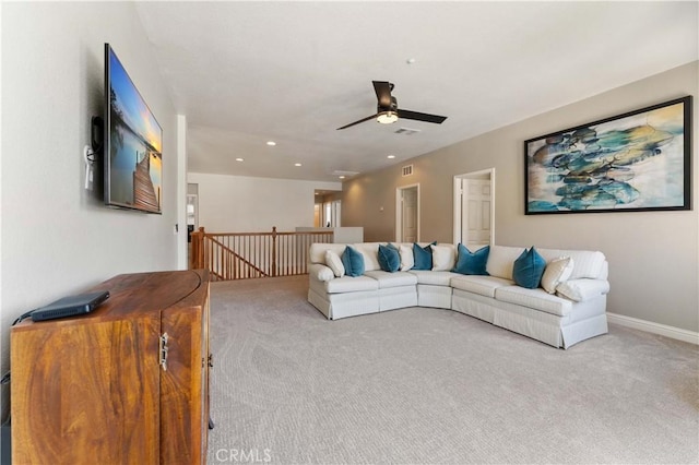 carpeted living room featuring ceiling fan, baseboards, visible vents, and recessed lighting