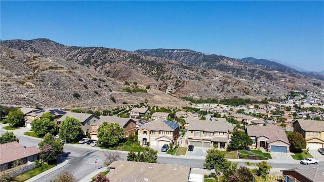 bird's eye view with a residential view and a mountain view