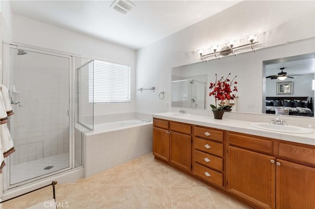 full bathroom featuring a stall shower, a sink, visible vents, and connected bathroom