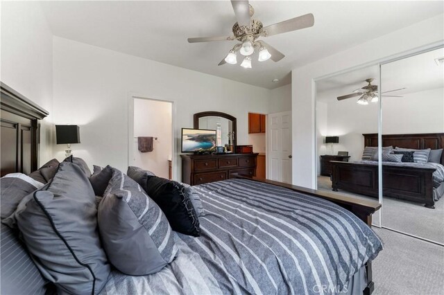 bedroom with ceiling fan, a closet, carpet, and visible vents