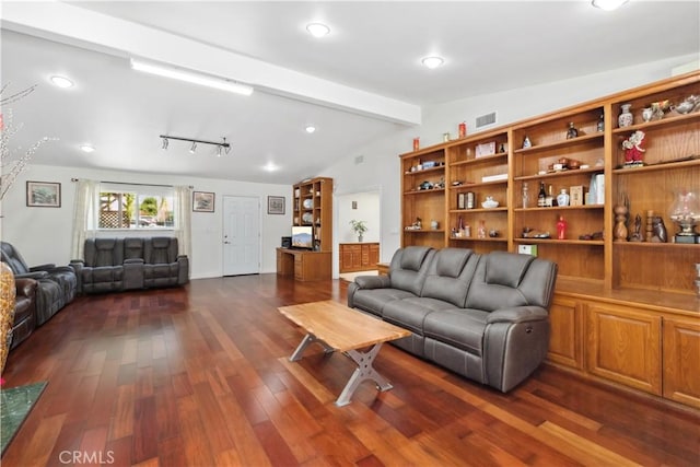 living room with lofted ceiling with beams, visible vents, and dark wood finished floors