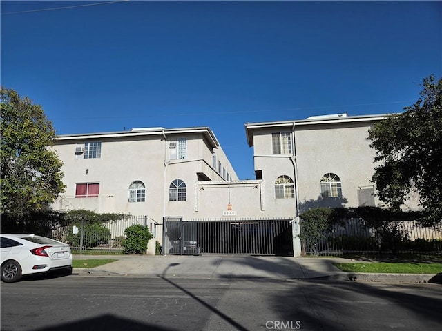 9146 Tobias Ave Unit 3, Panorama City, CA 91402 - view of front facade with stucco siding and a gate