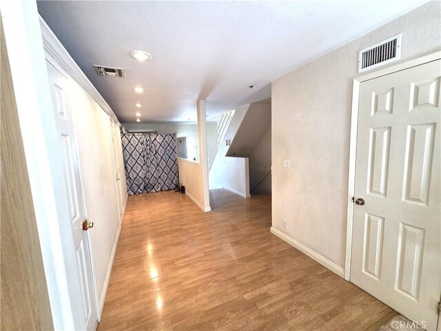 9146 Tobias Ave Unit 3, Panorama City, CA 91402 - additional living space featuring light wood-type flooring, baseboards, recessed lighting, and stairway