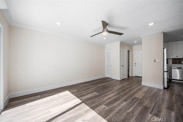 unfurnished living room featuring dark wood-type flooring, recessed lighting, ornamental molding, and baseboards