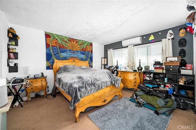 bedroom with a textured ceiling and an AC wall unit