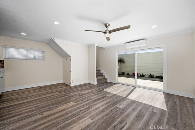 bonus room with a wall mounted AC, recessed lighting, wood finished floors, and baseboards