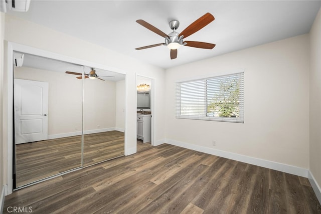 unfurnished bedroom featuring ceiling fan, baseboards, and wood finished floors