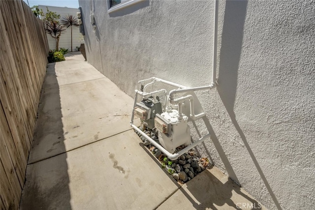 view of patio featuring fence