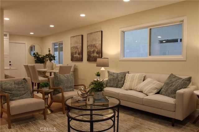 living area featuring wood finished floors and recessed lighting