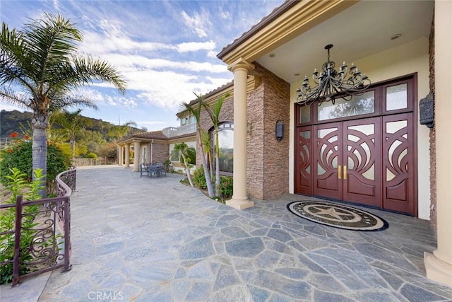 view of exterior entry featuring stone siding