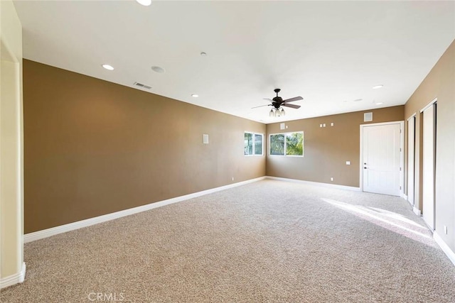 unfurnished room with visible vents, baseboards, a ceiling fan, carpet, and recessed lighting