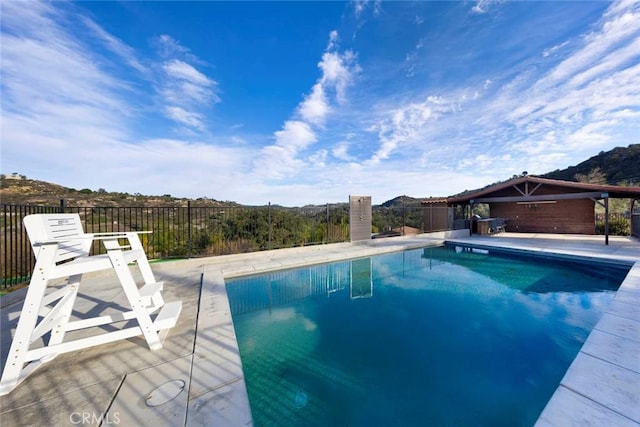 view of pool with a patio area, fence, and a fenced in pool