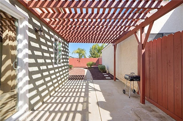 view of patio / terrace with a grill, a fenced backyard, and a pergola