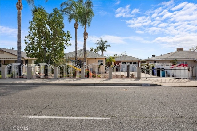 view of front of home featuring a fenced front yard and a gate