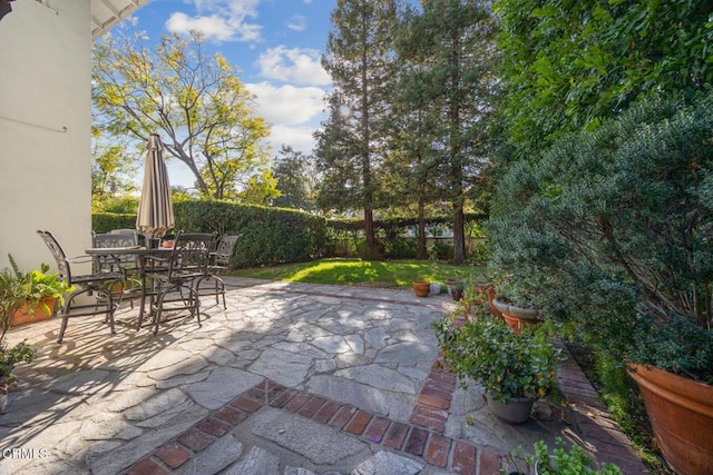 view of patio with fence private yard and outdoor dining space