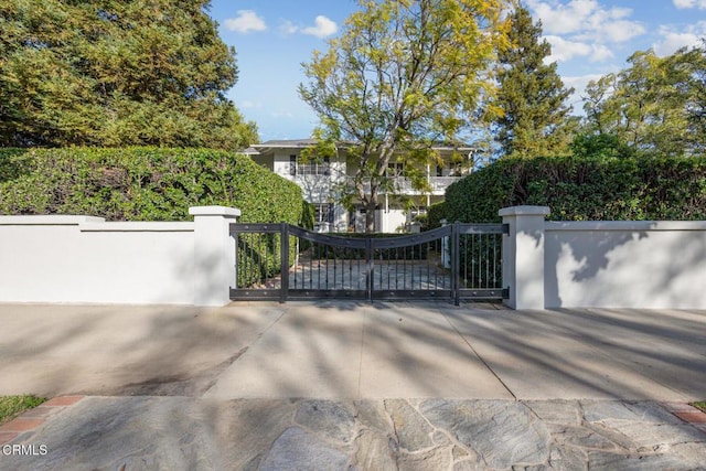 view of gate featuring a fenced front yard