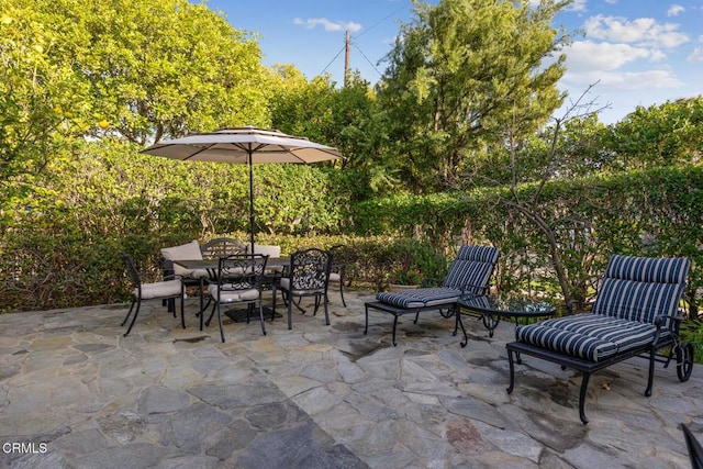 view of patio featuring outdoor dining space