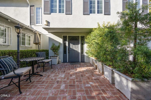 property entrance featuring stucco siding