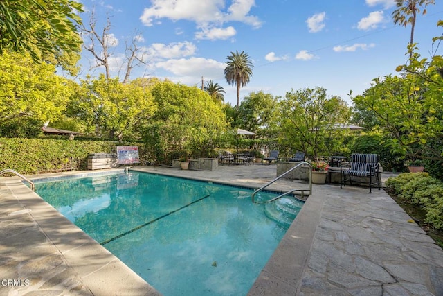 pool with a patio