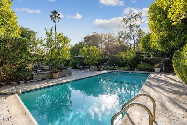 outdoor pool featuring a patio