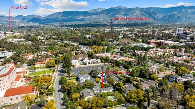 birds eye view of property with a mountain view