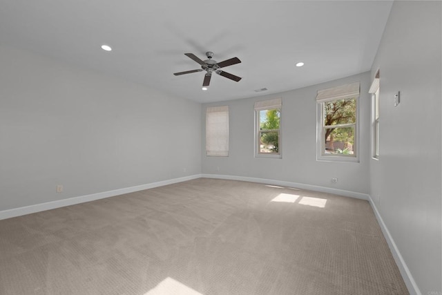 spare room featuring recessed lighting, baseboards, ceiling fan, and light colored carpet