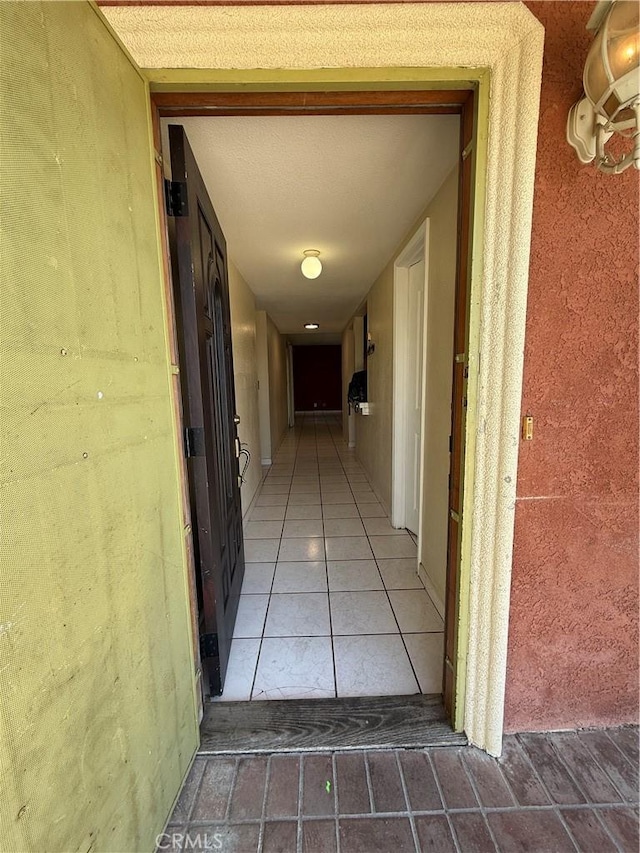 corridor featuring tile patterned flooring