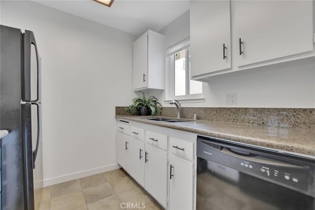 kitchen with baseboards, light countertops, black appliances, white cabinetry, and a sink