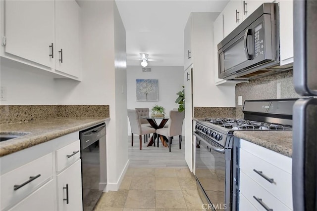 kitchen featuring ceiling fan, light tile patterned flooring, white cabinets, backsplash, and black appliances