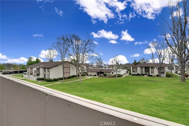 view of front of home with a front lawn and a residential view