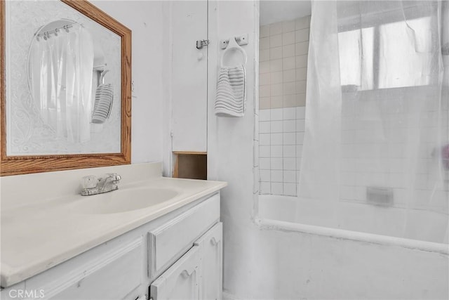 bathroom featuring vanity and tub / shower combination