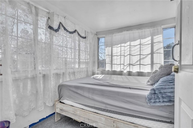 bedroom featuring multiple windows