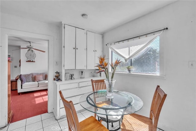 dining room featuring light tile patterned flooring and a ceiling fan