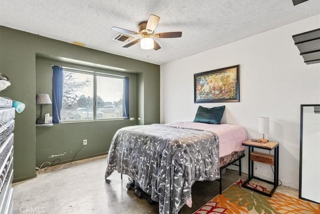 bedroom featuring a fireplace, visible vents, ceiling fan, a textured ceiling, and baseboards