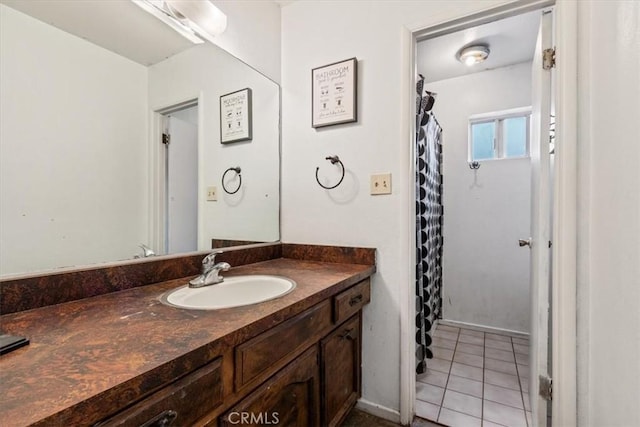 bathroom with tile patterned floors and vanity