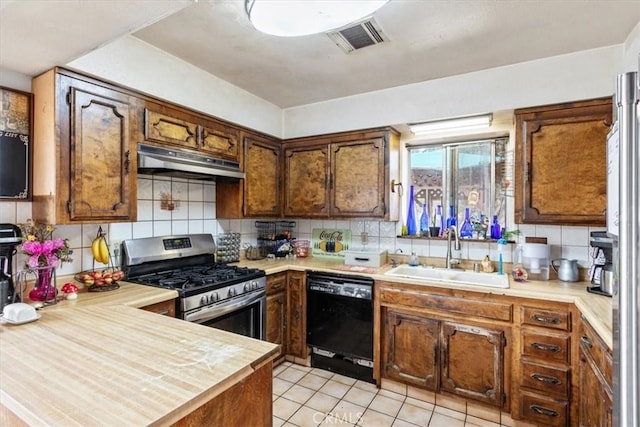 kitchen featuring under cabinet range hood, a sink, visible vents, stainless steel range with gas cooktop, and dishwasher