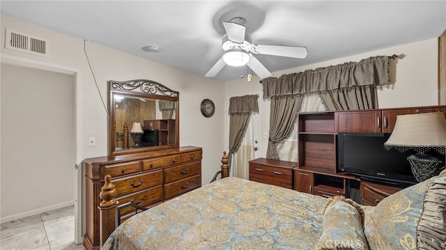 bedroom with ceiling fan, light tile patterned floors, visible vents, and baseboards