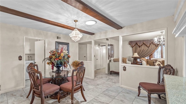 dining area with washer / dryer, visible vents, a notable chandelier, and beamed ceiling