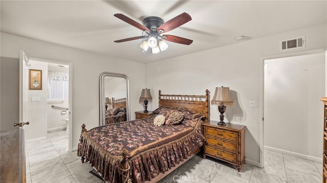 bedroom with a ceiling fan, connected bathroom, visible vents, and baseboards