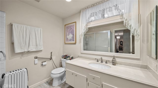 full bathroom with toilet, a shower stall, radiator heating unit, and vanity